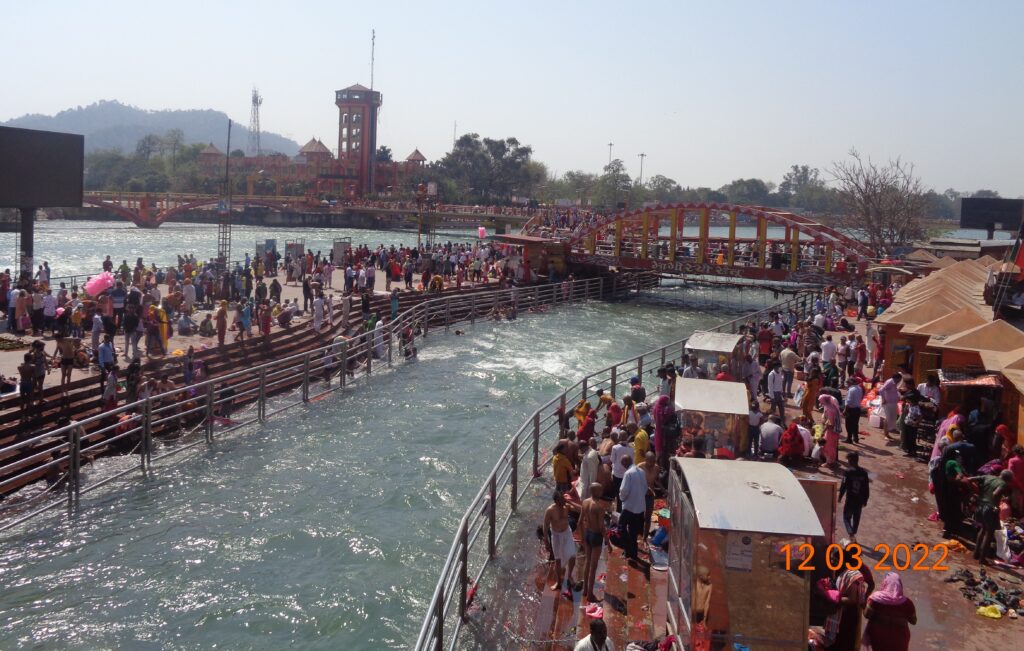 Morning view of Har Ki Pauri ghat with devotees performing rituals