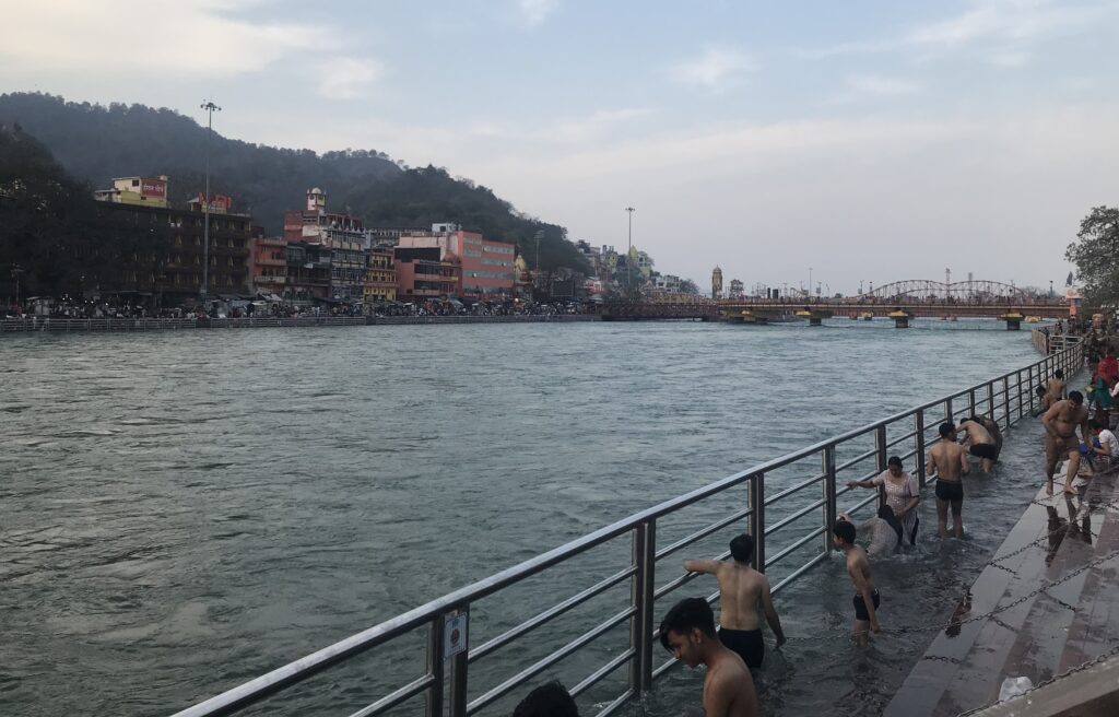 Pilgrims taking a holy dip in the Ganga at Har Ki Pauri, Haridwar