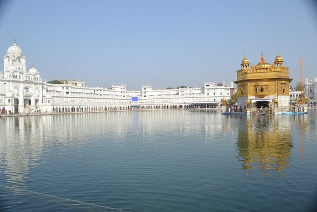The Golden Temple, surrounded by the Pool of Nectar, glows with divine serenity.