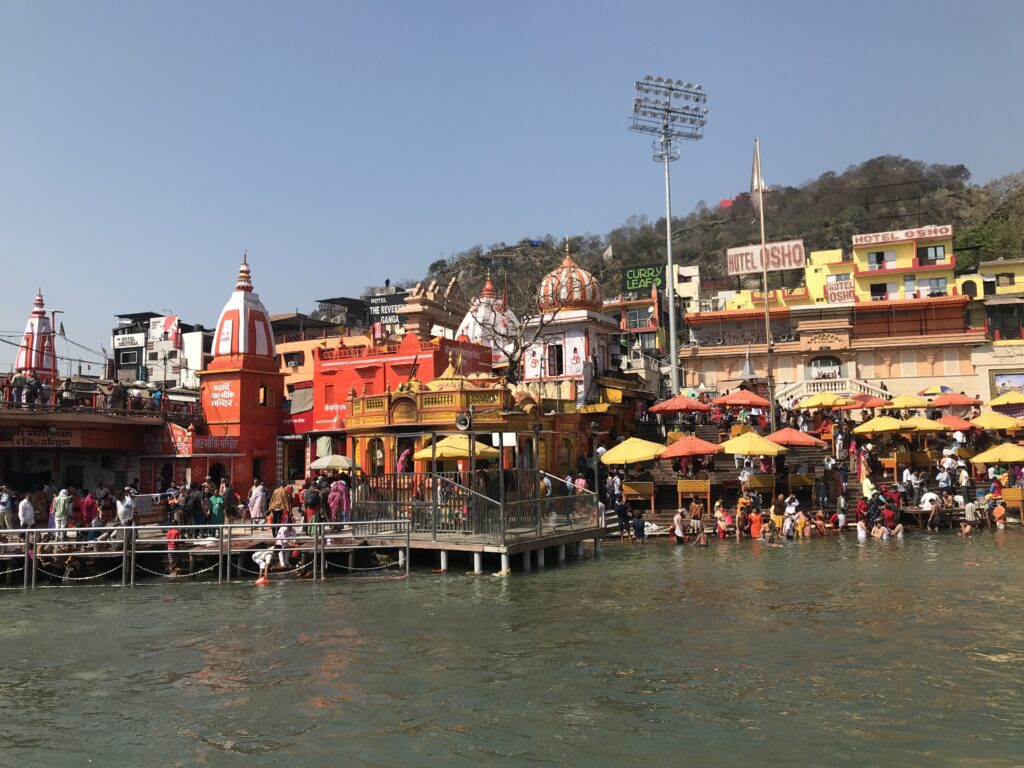 Morning view of Haridwar with devotees gathering along the riverbank