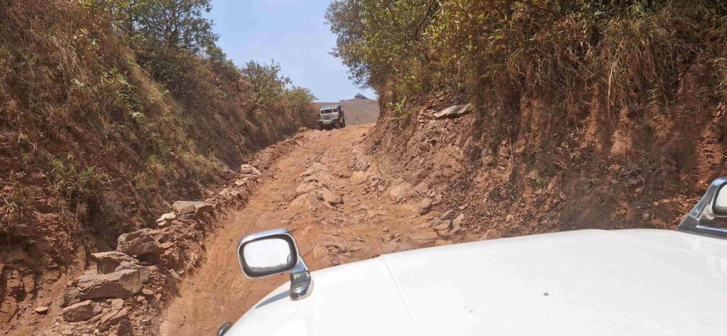 Steep rocky jeep trail leading toward the trekking base of Kudajadri