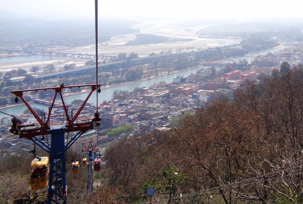 From above, the city of faith looked peaceful, the Ganga winding through temples and rooftops like a blessing from the hills.