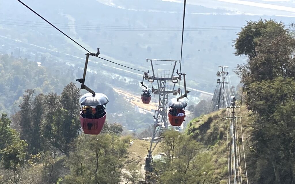 Floating over Haridwar — the ride to Mansa Devi feels like gliding through faith.”