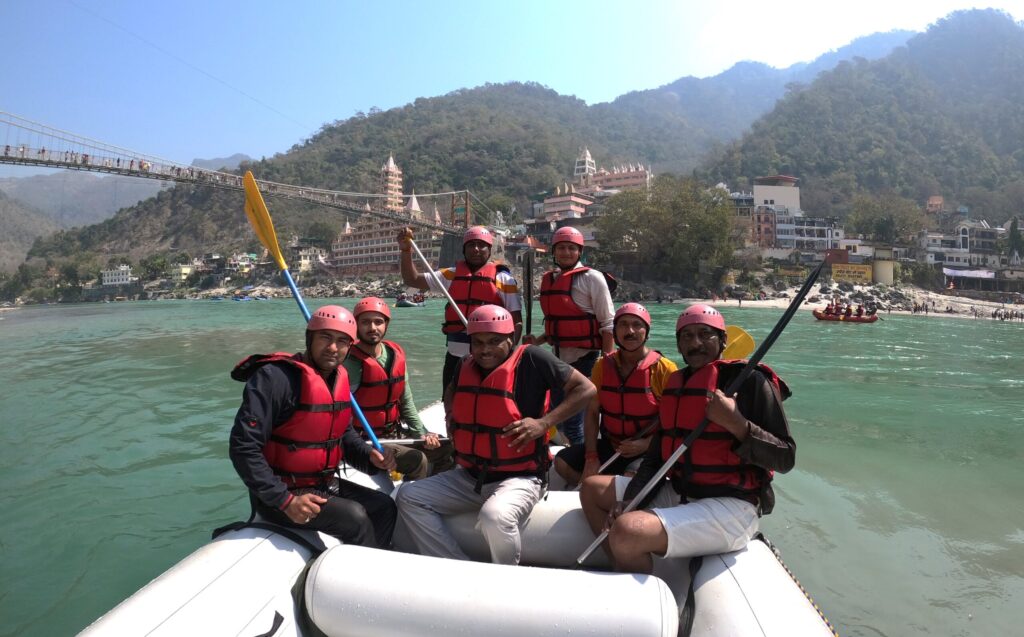 Group rafting moment on the River Ganga near Lakshman Jhula, Rishikesh