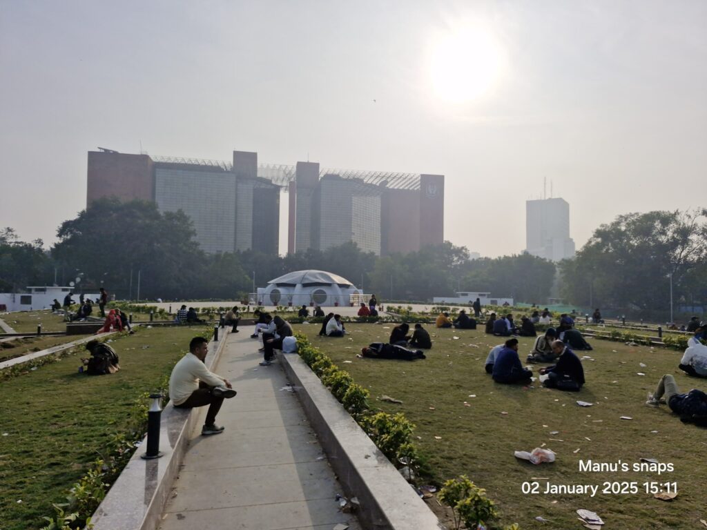 People relaxing on lawns at Central Park Connaught Place New Delhi