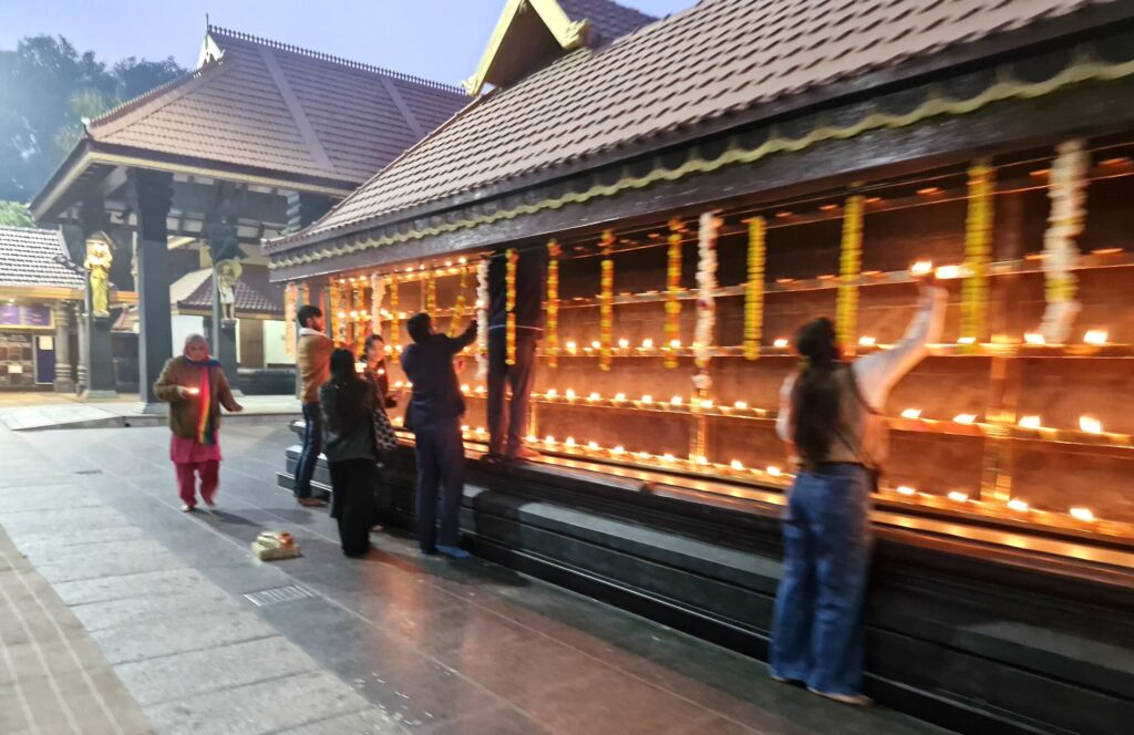 Devotees lighting oil lamps at Uttara Guruvayurappan Hindu temple in New Delhi