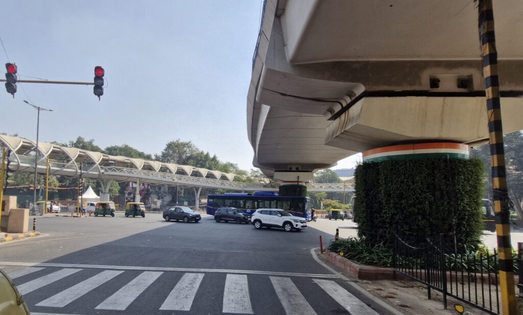Delhi Metro elevated track above busy intersection in New Delhi