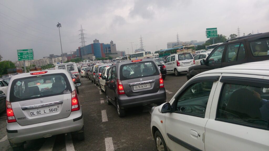 Cars and buses stuck in traffic on Delhi road