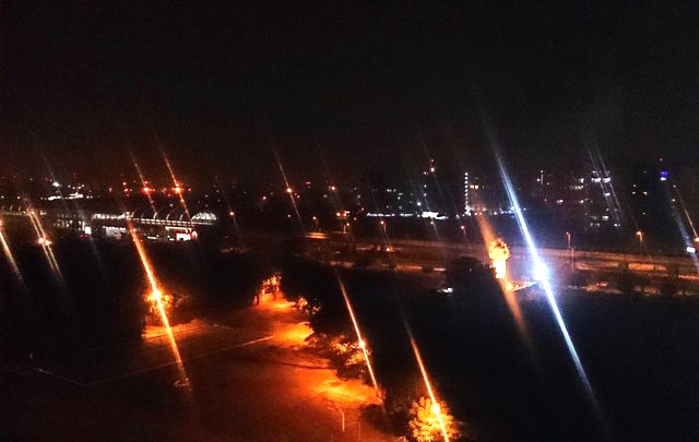 Night cityscape with streetlights and traffic lights in New Delhi