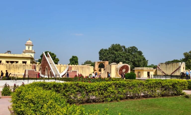 Panoramic view of Jantar Mantar Jaipur observatory with Samrat Yantra and other astronomical instruments in a landscaped garden
